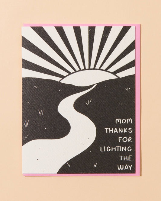 Greeting card with black and white design and text on a beige background says: Mom, thanks for lighting the way