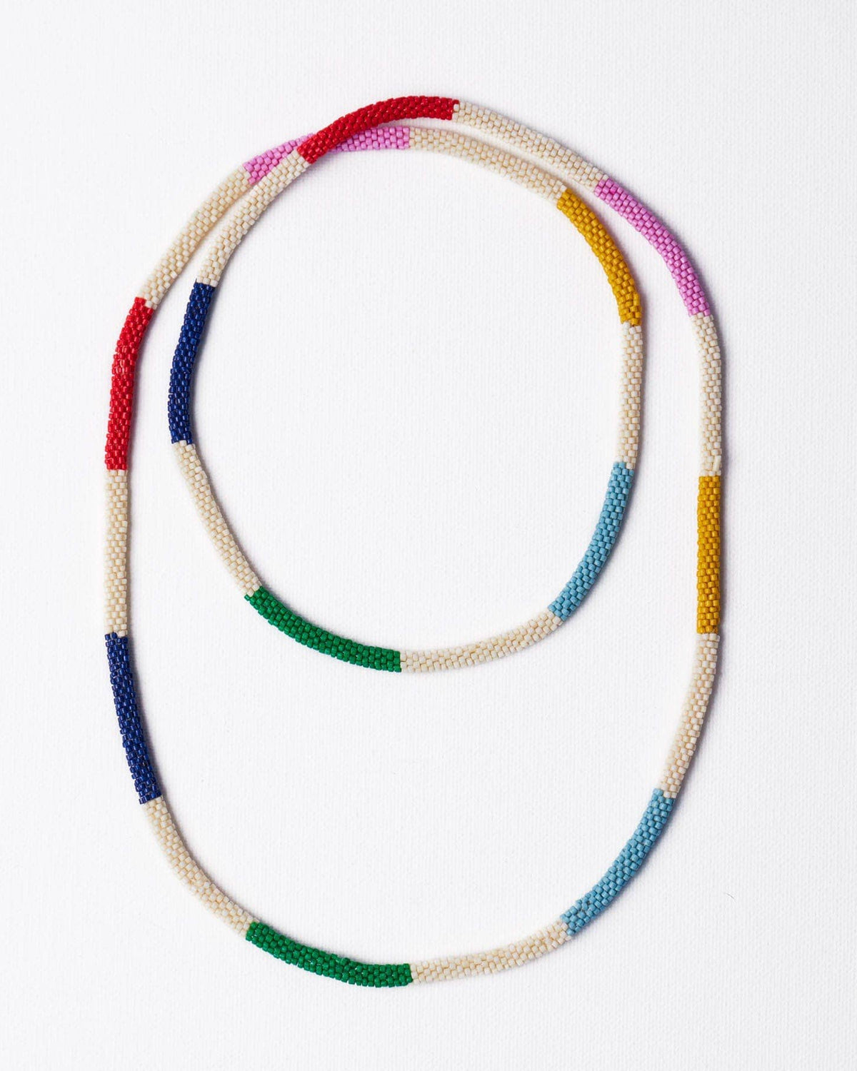 Long + Colorful beaded necklace on a white background