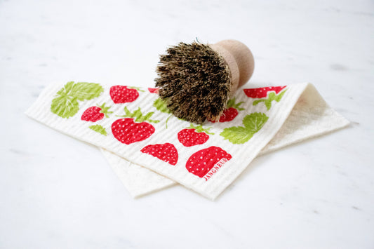 Swedish dish cloth with strawberry pattern on a white background
