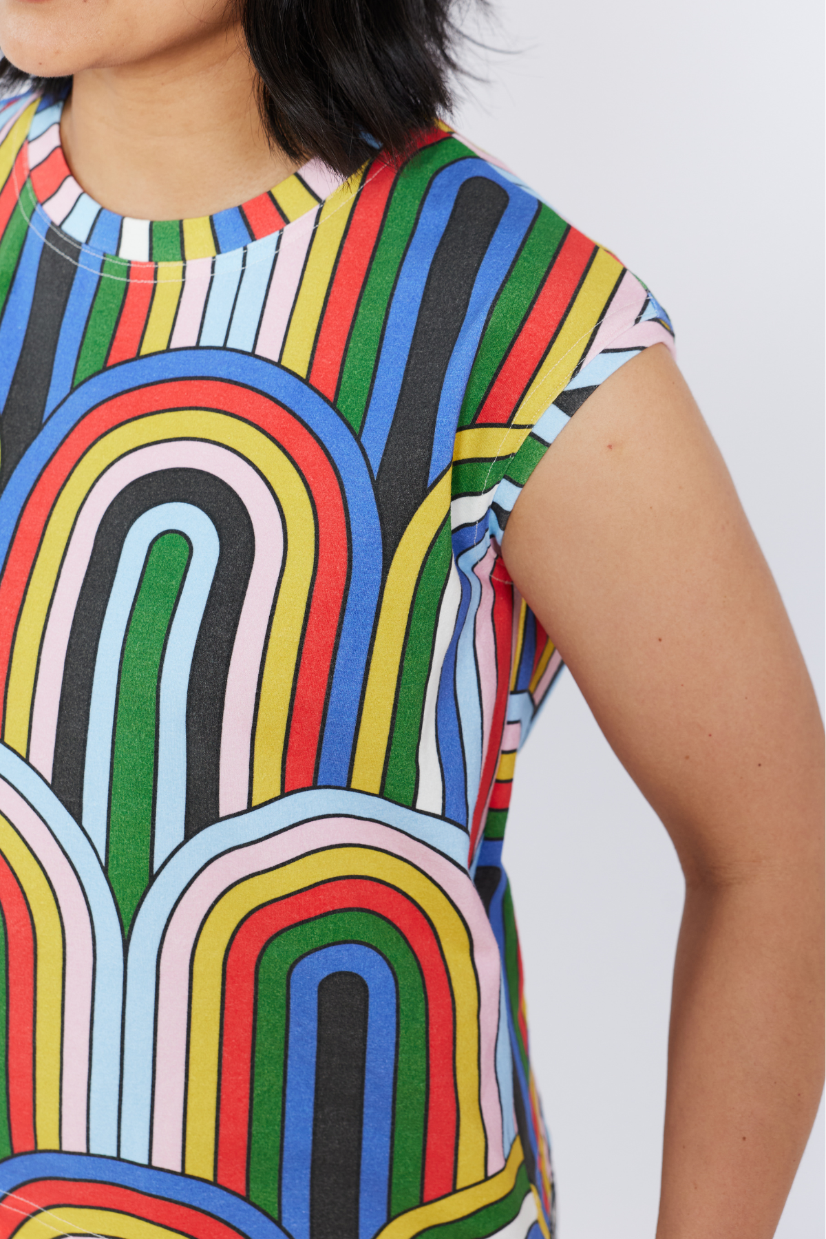 Colorful abstract patterned tank top by Lilla Barn Clothing on a plain background