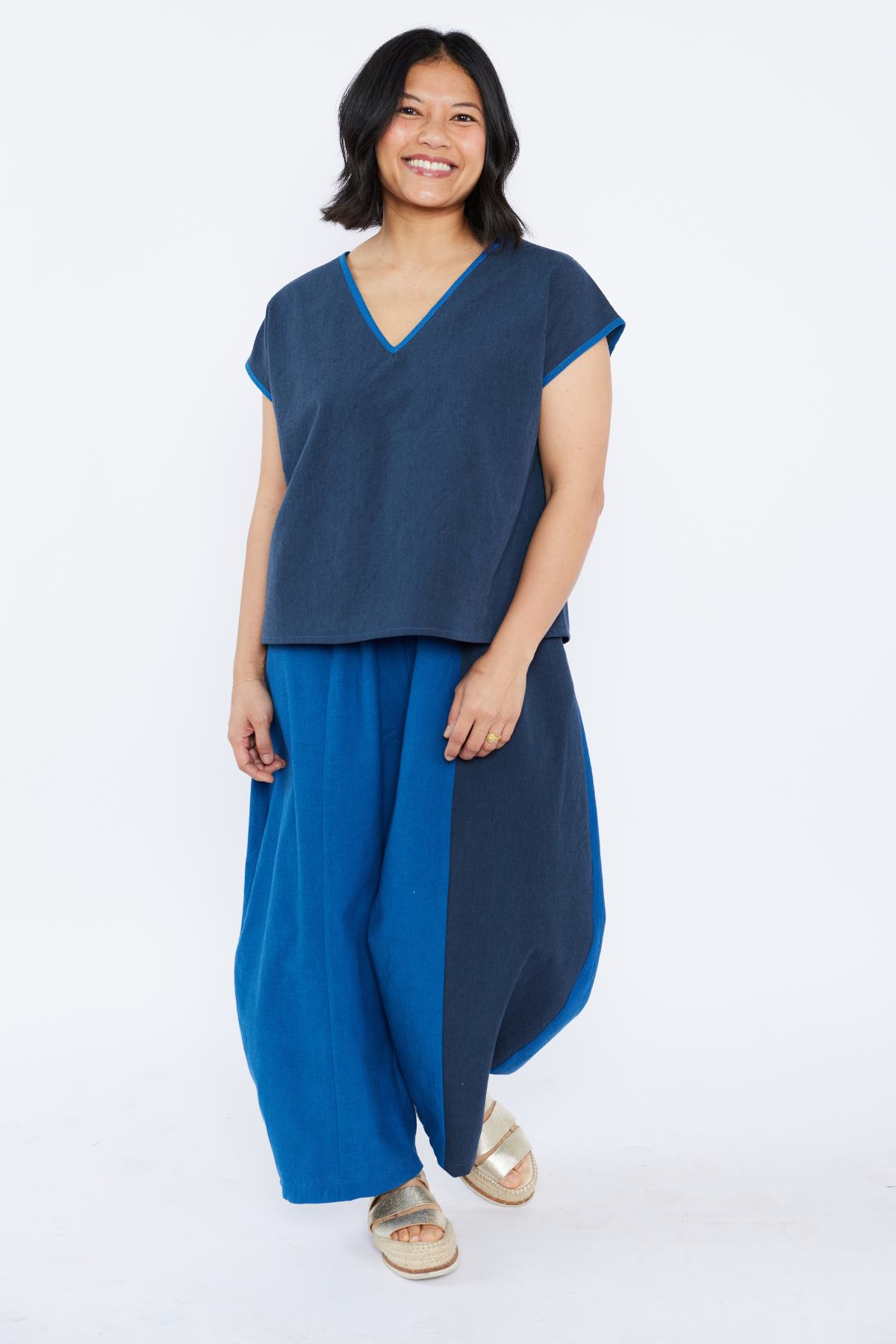 Woman wearing a blue outfit on a white background