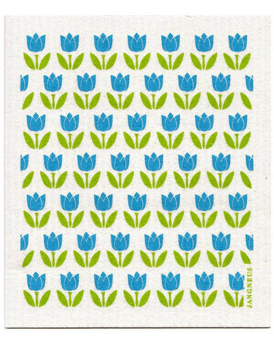 A white Swedish dishcloth with a green and blue floral pattern of tulips, designed by Jangneus in Sweden.