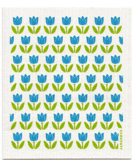 A white Swedish dishcloth with a green and blue floral pattern of tulips, designed by Jangneus in Sweden.