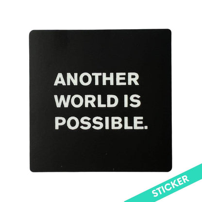 Black square sticker with 'Another World is Possible' text on a white background