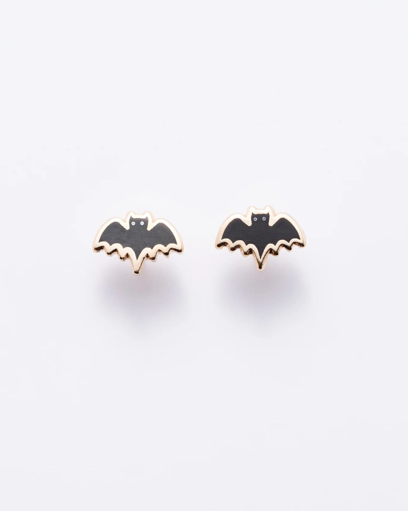 Bat-shaped earrings on a white background