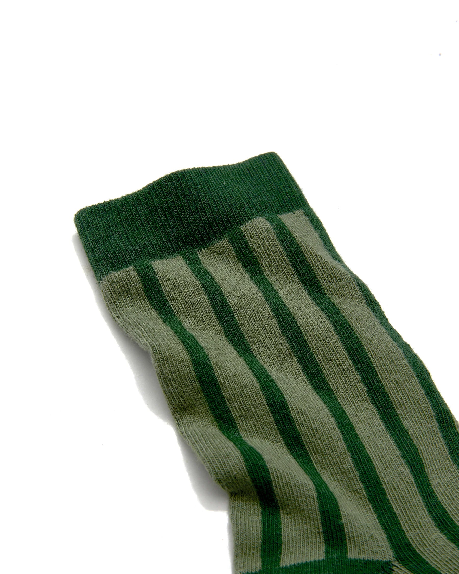 Green striped organic cotton adult sock on a white background