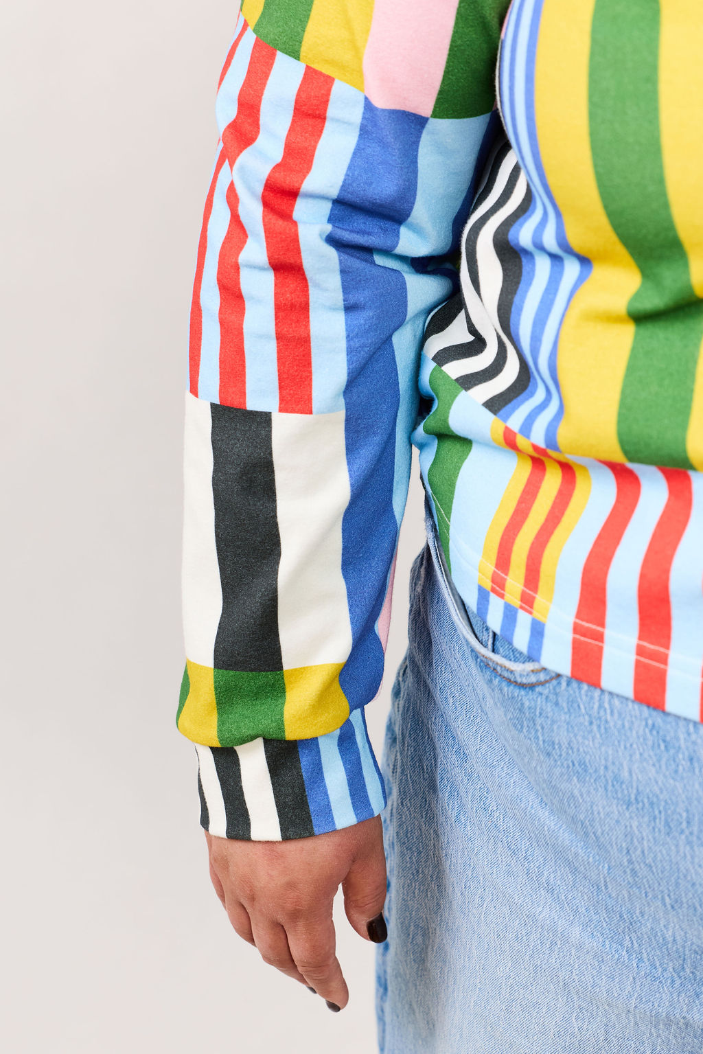 Colorful striped shirt with a plain background