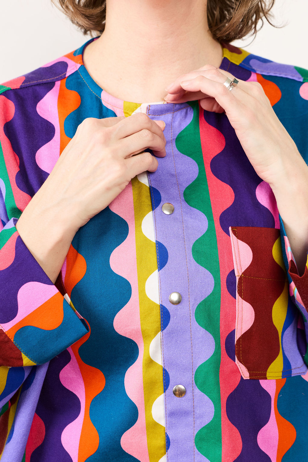 Colorful patterned shirt from Lilla Barn Clothing with a focus on the collar area.
