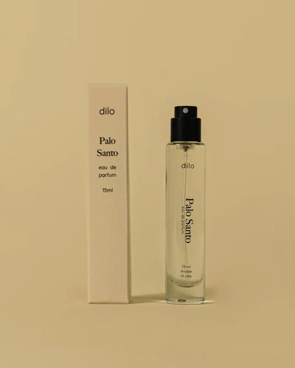 Dilo Palo Santo eau de parfum bottle and packaging on a beige background