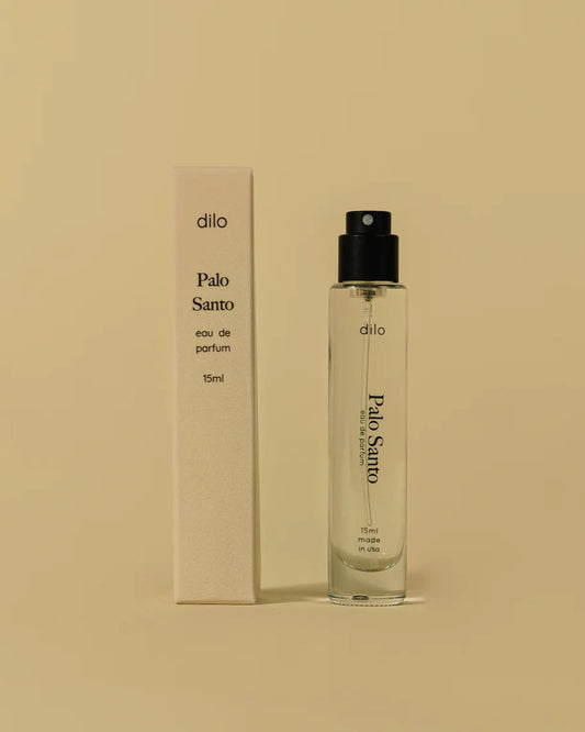 Dilo Palo Santo eau de parfum bottle and packaging on a beige background