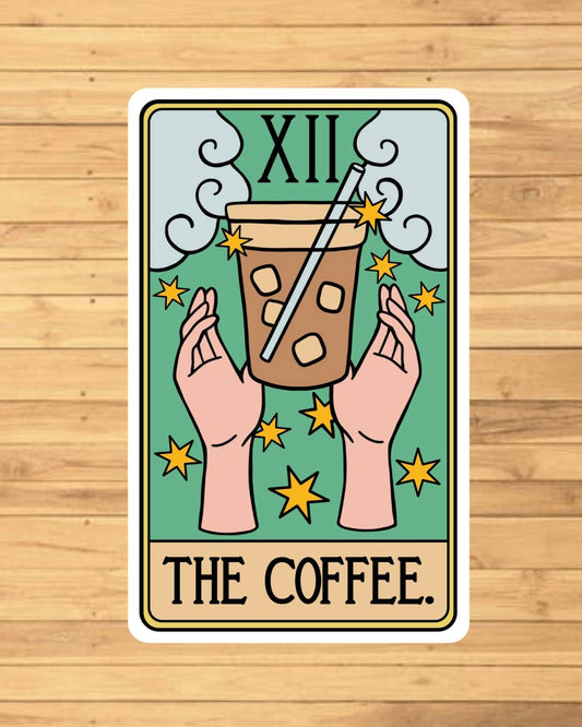 Card with a coffee cup and hands on a wooden surface