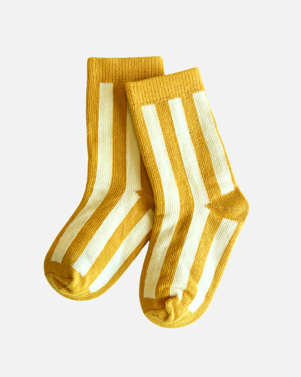 A pair of striped baby socks in yellow and white, made of cotton, designed for babies and kids.