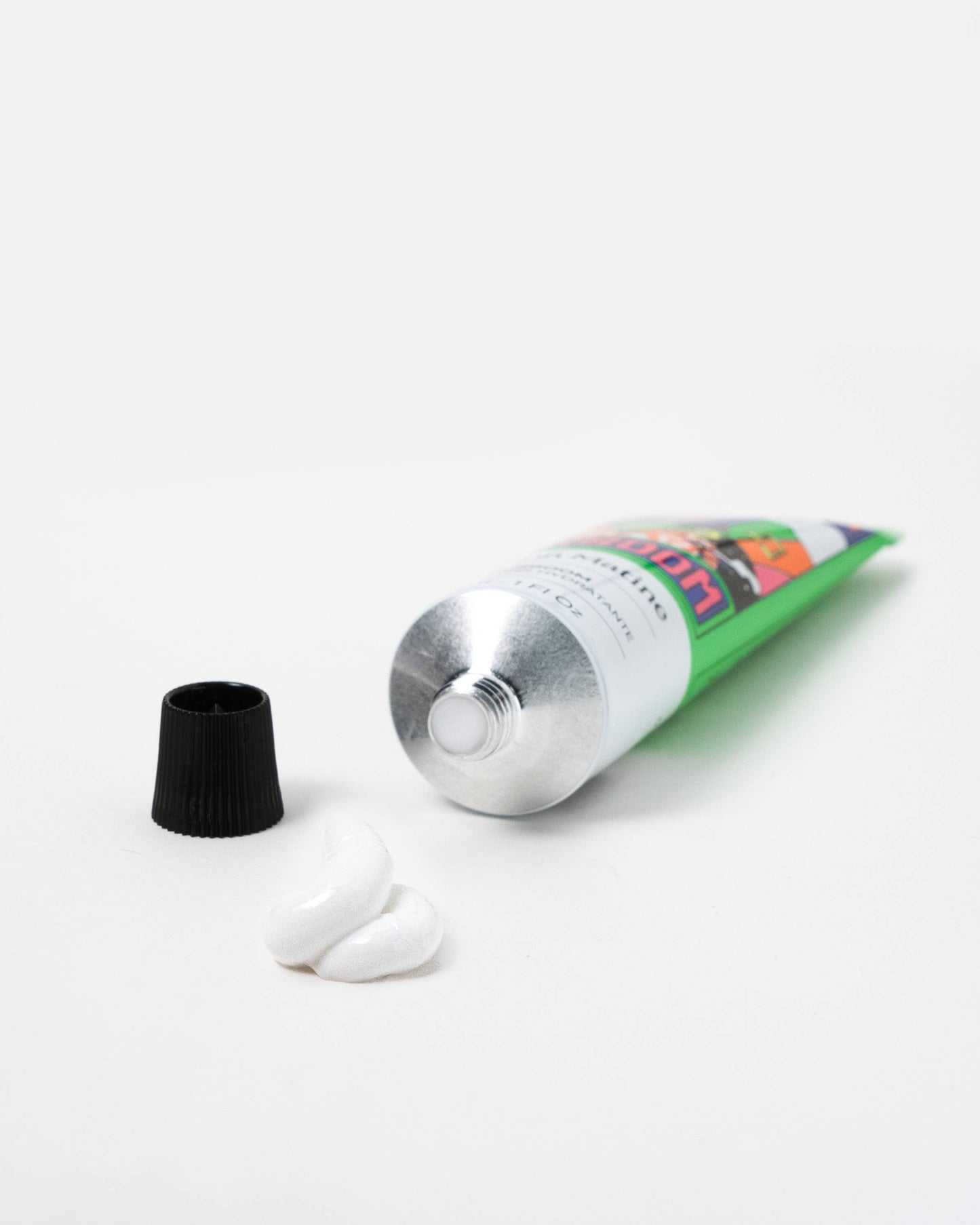 Tube of Surboom floral hand cream with cap on a white background