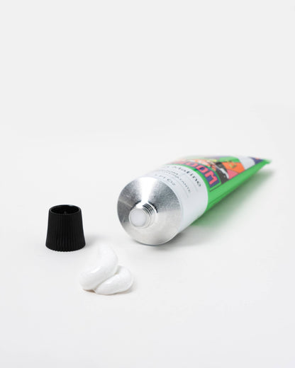 Tube of Surboom floral hand cream with cap on a white background