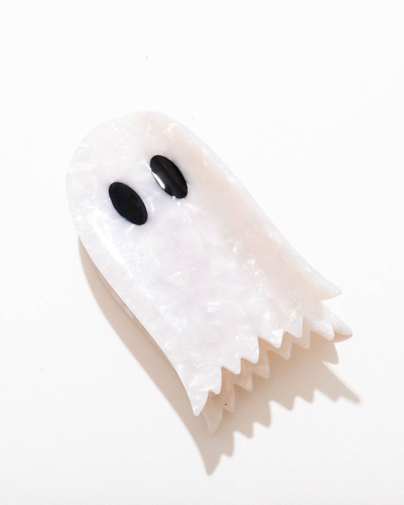 ghost shaped hair claw clip on a white background
