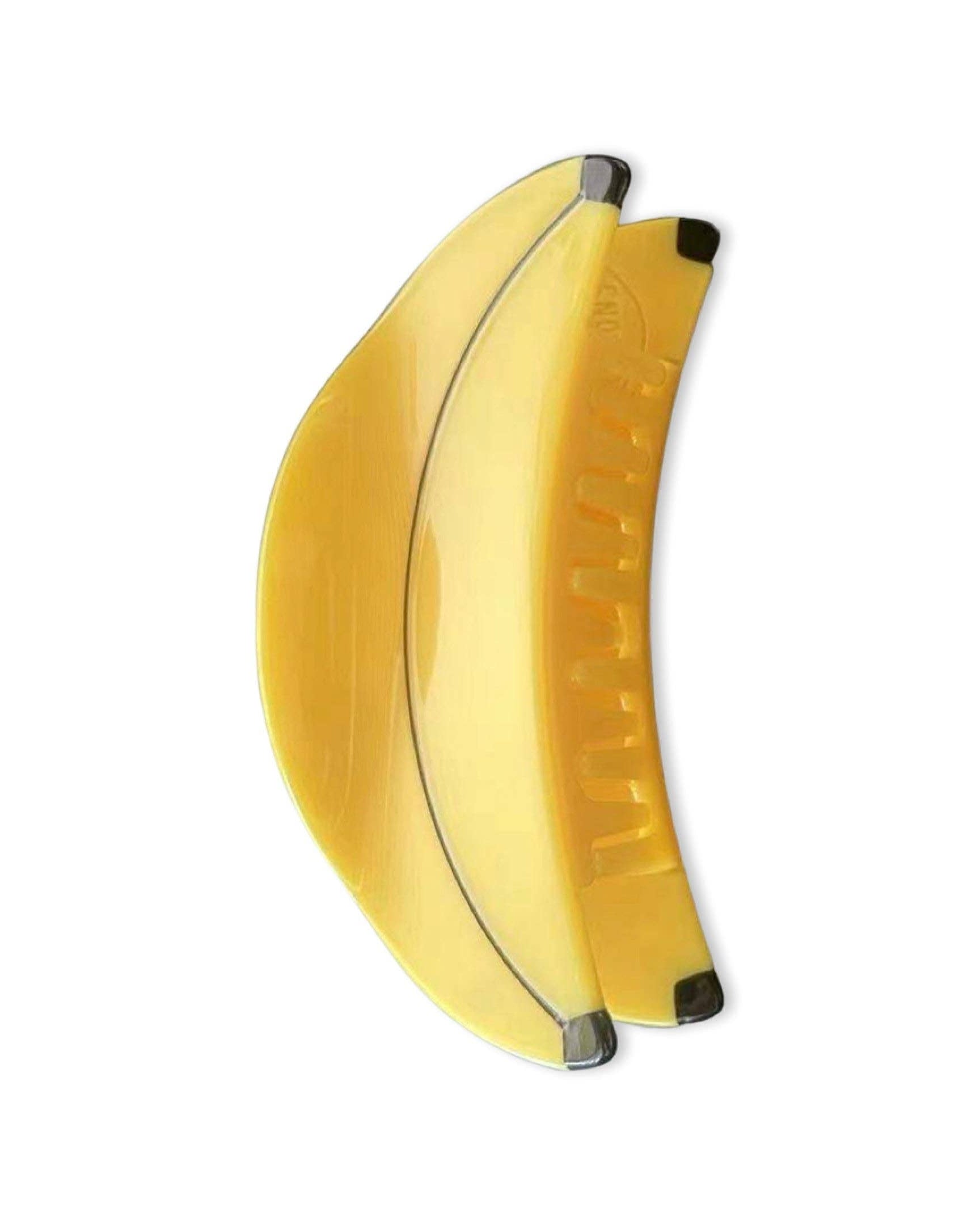 Yellow banana-shaped hair claw clip on a white background