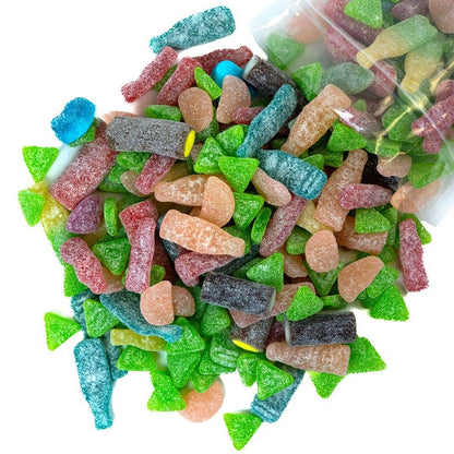 Assorted colorful Swedish gummy candies with a clear bag in the background.