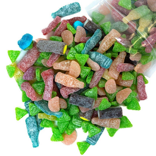 Assorted colorful Swedish gummy candies with a clear bag in the background.