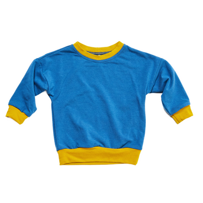 blue and yellow bamboo baby pullover lying flat