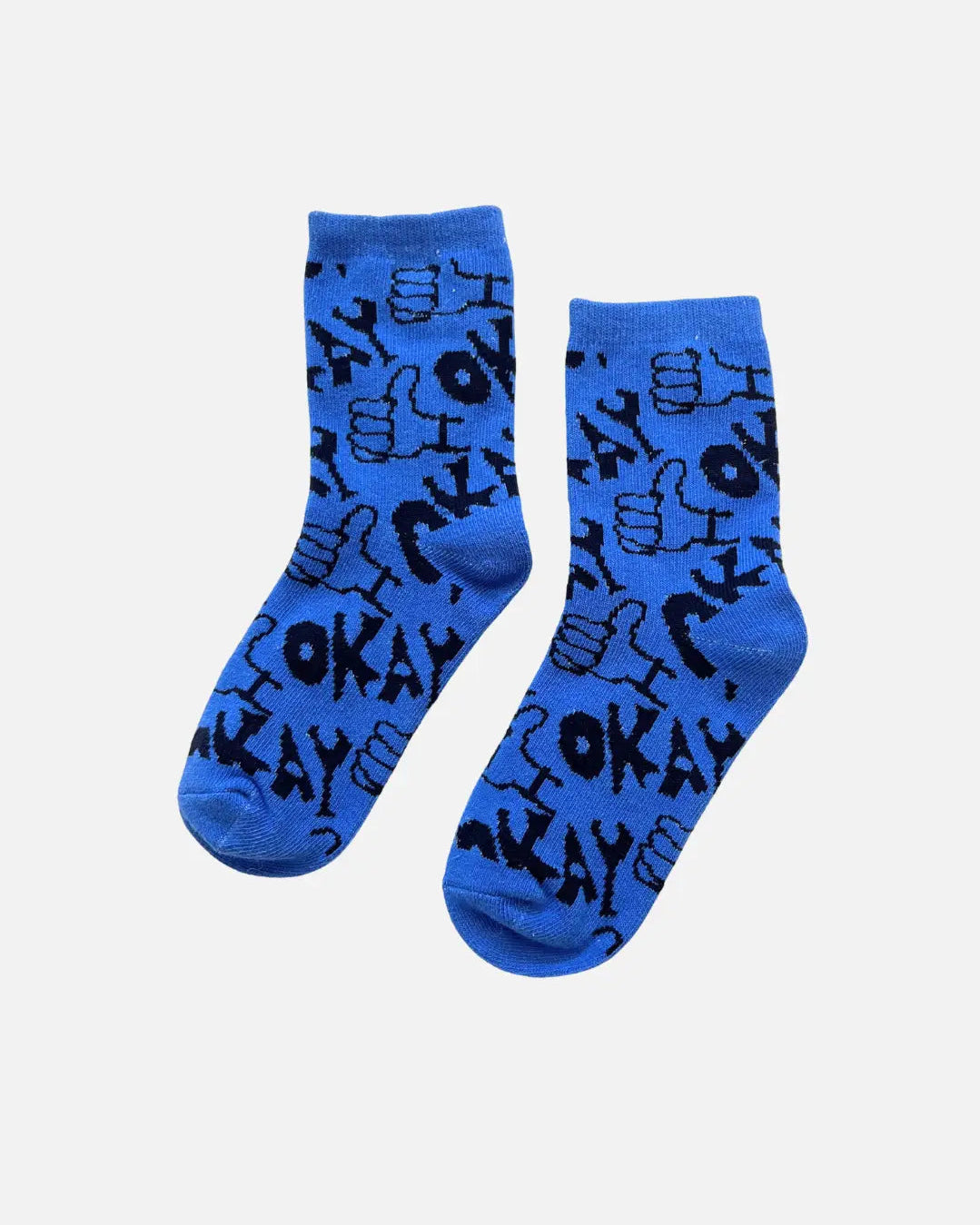 Blue kid socks with black text and graphics on a light gray background