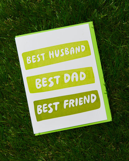 Card with 'Best Husband, Best Dad, Best Friend' text on a grass background