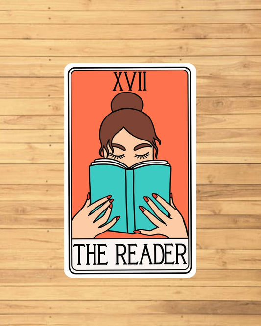 vinyl sticker of a tarot card that says The Reader and features a person reading a blue book
