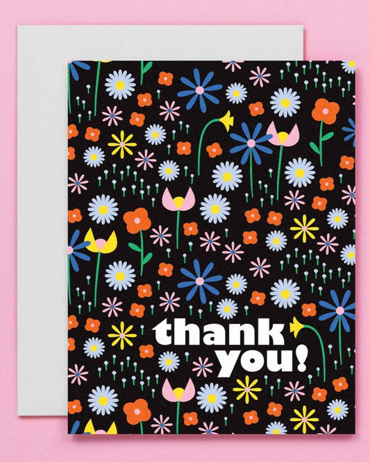 thank you card on black background with colorful illustrated flowers