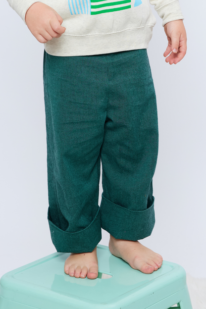 green cotton toddler pants with a cuff leg