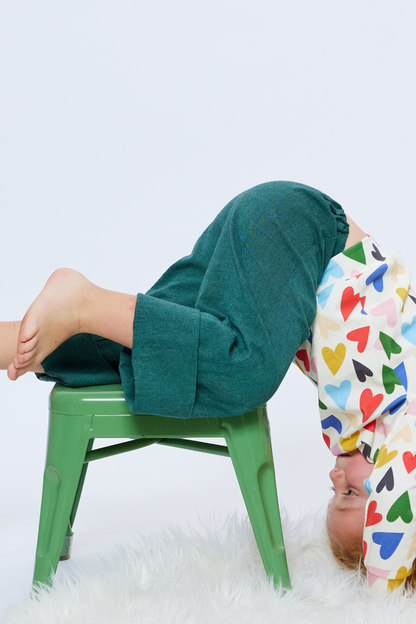 toddler playing wearing colorful sustainable green pants