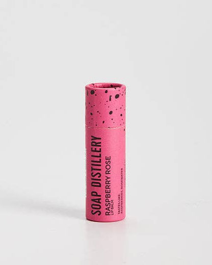 Moisturizing lip balm with raspberry & rose scent in compostable packaging. 