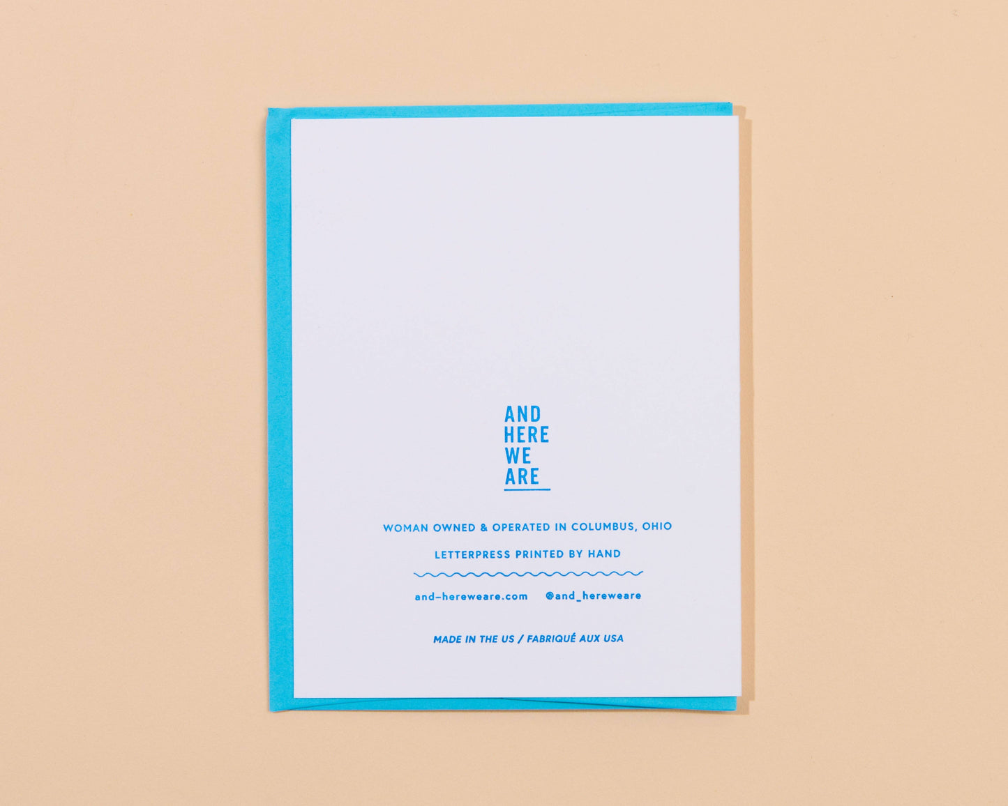 Greeting card with blue text on a beige background