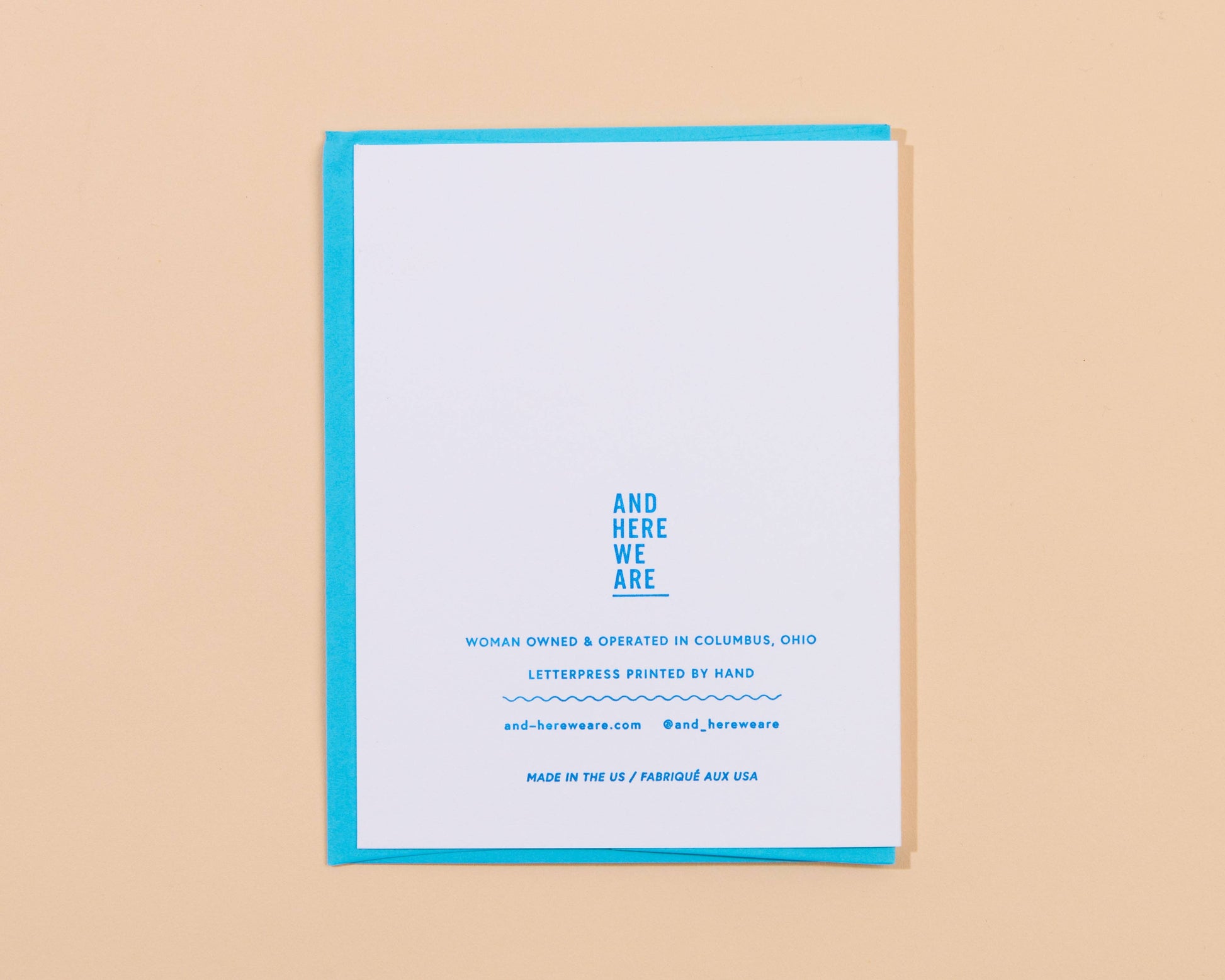 Greeting card with blue text on a beige background