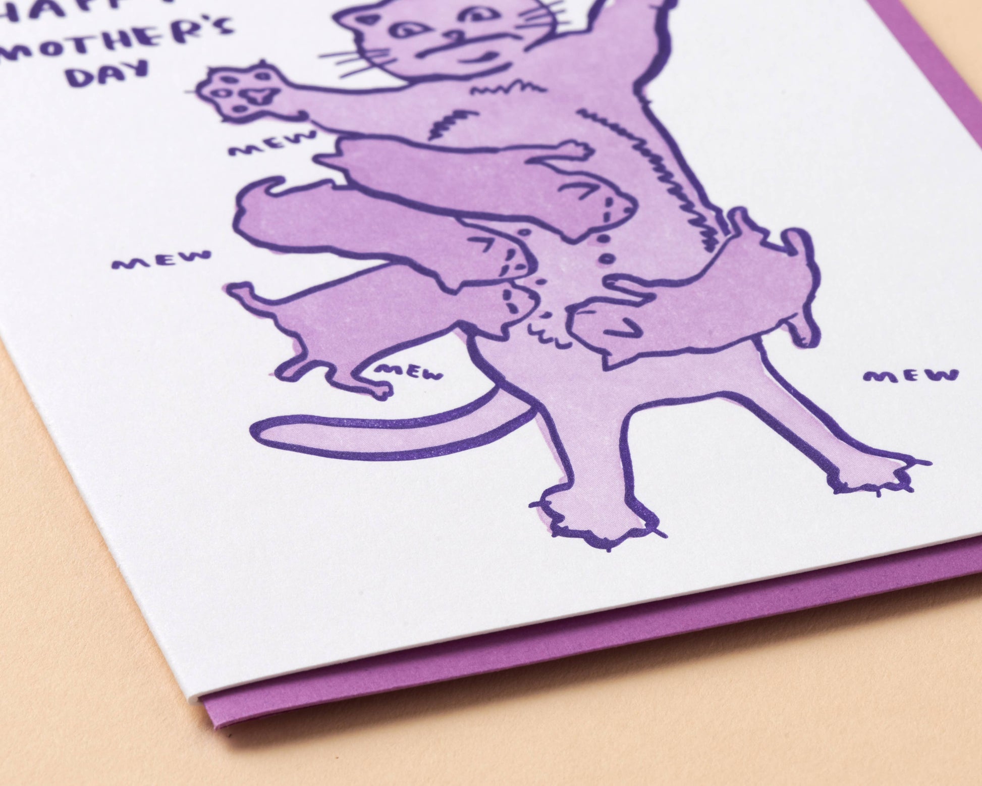 Greeting card with purple cats and 'Happy Mother's Day' text on a beige background