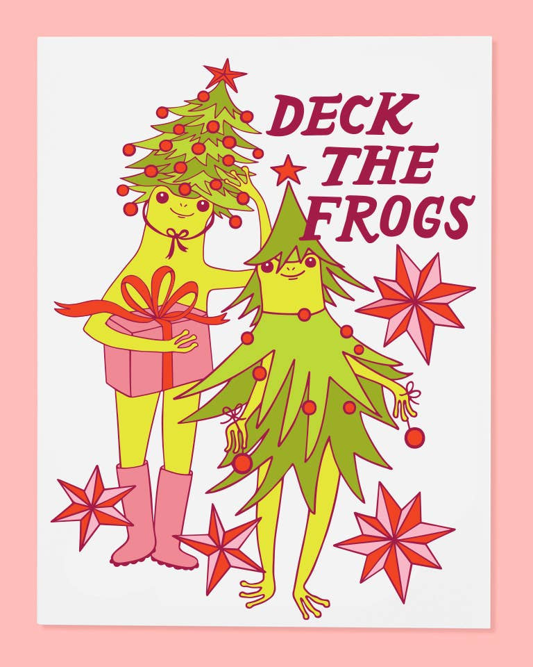 Holiday greeting card featuring an Illustration of frogs decorating with a Christmas tree and gift, text 'Deck the Frogs' on a pink background.