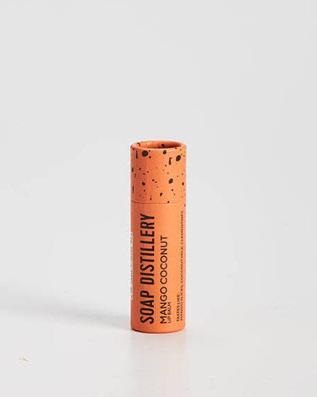 Moisturizing lip balm with mango coconut scent in compostable packaging. 