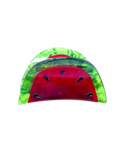 A hair claw clip designed to resemble a mini watermelon, with a red seed-like pattern on a clear background.