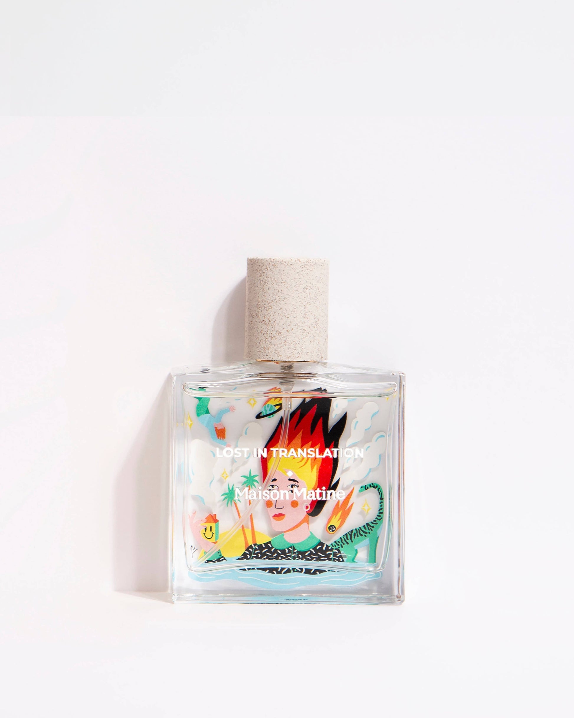 Perfume bottle with colorful label on a white background. Glass bottle says Lost in Translation.
