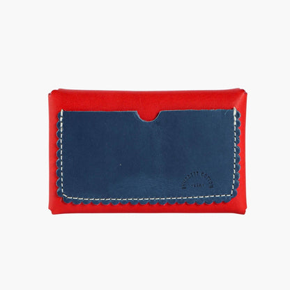 Red and blue leather wallet with visible brand name on a white background