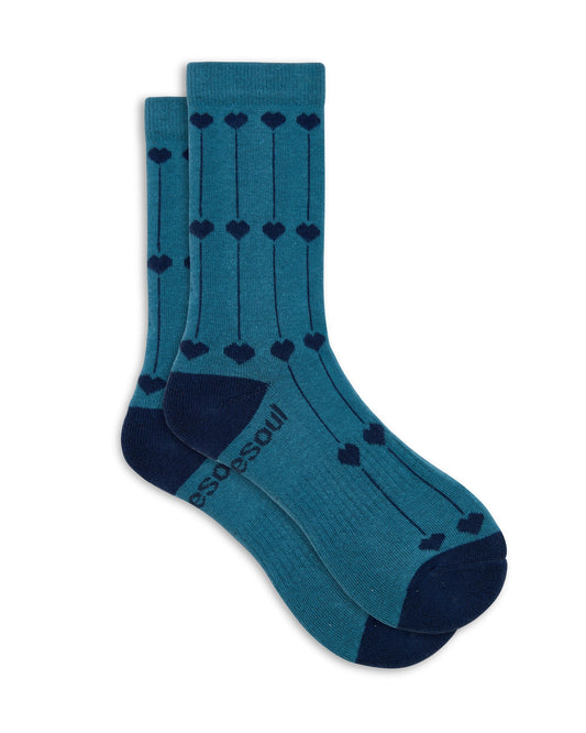 Pair of teal socks with navy hearts on a white background