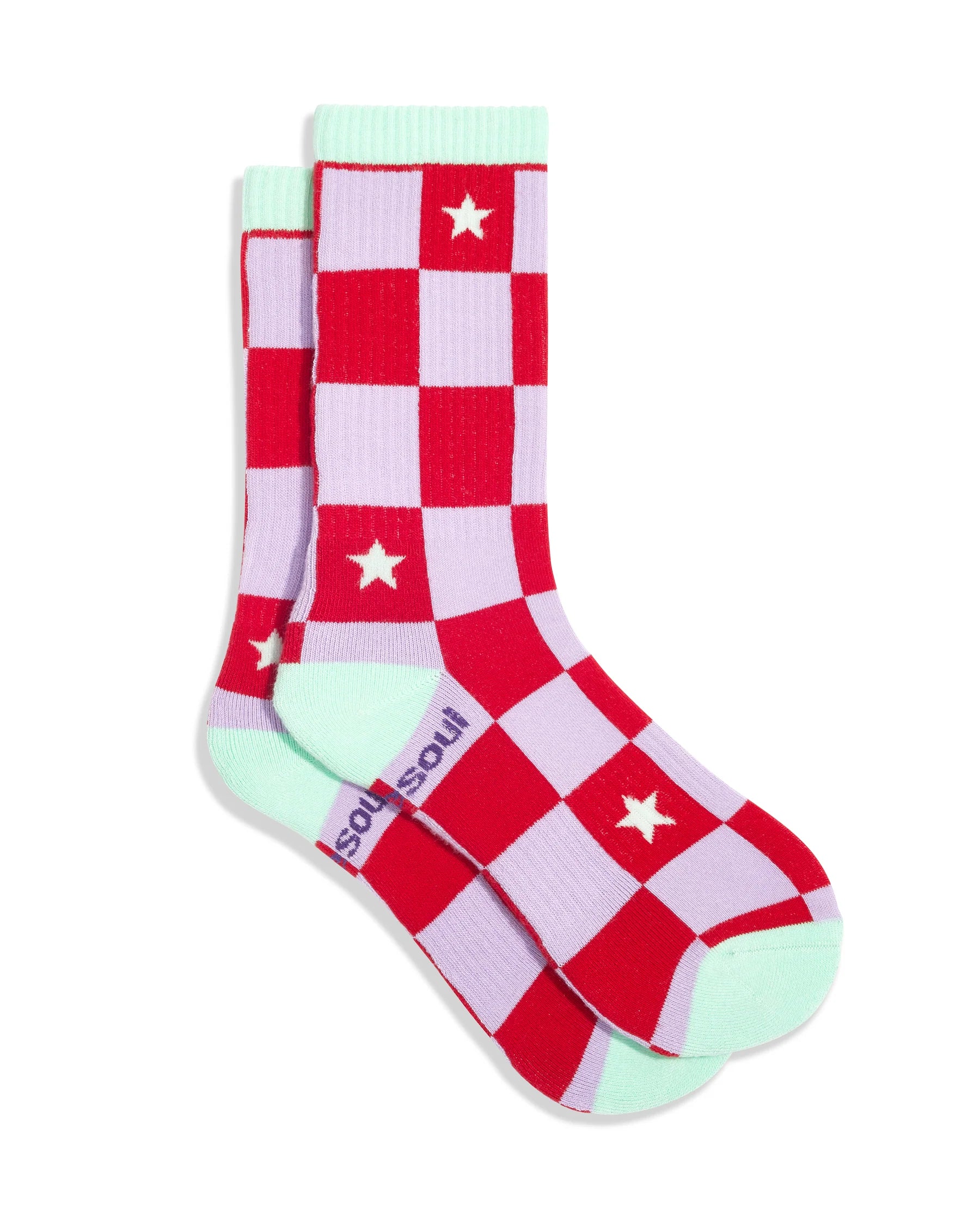 Red and pink checkered socks with star patterns and green accents on a white background