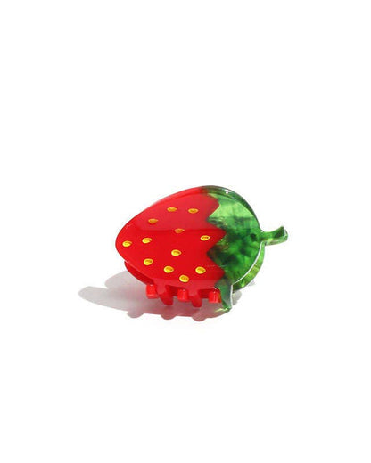 A mini strawberry-shaped hair claw with red and green colors on a white background.