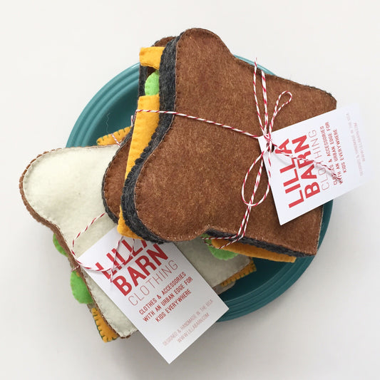 Lilla Barn Clothing Felt Play Sandwich includes bread, cheese, lettuce, and tomato. 